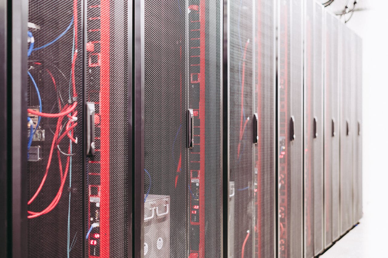 Modern data server room with network racks and cables.